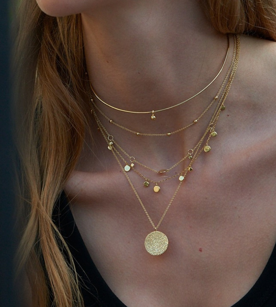 Gold necklace layering