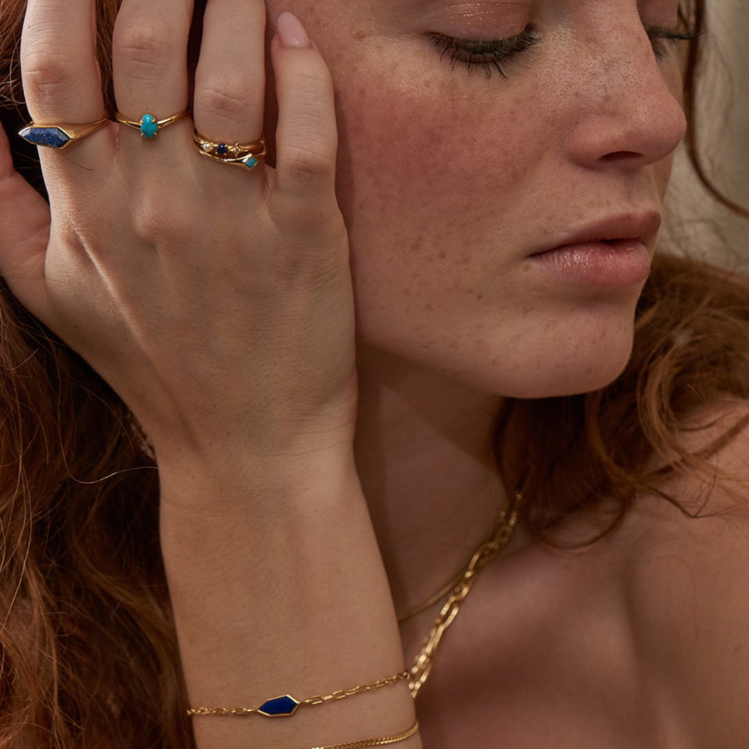 Woman with red hair wearing ania haie in blog about finding jewellery to suit you